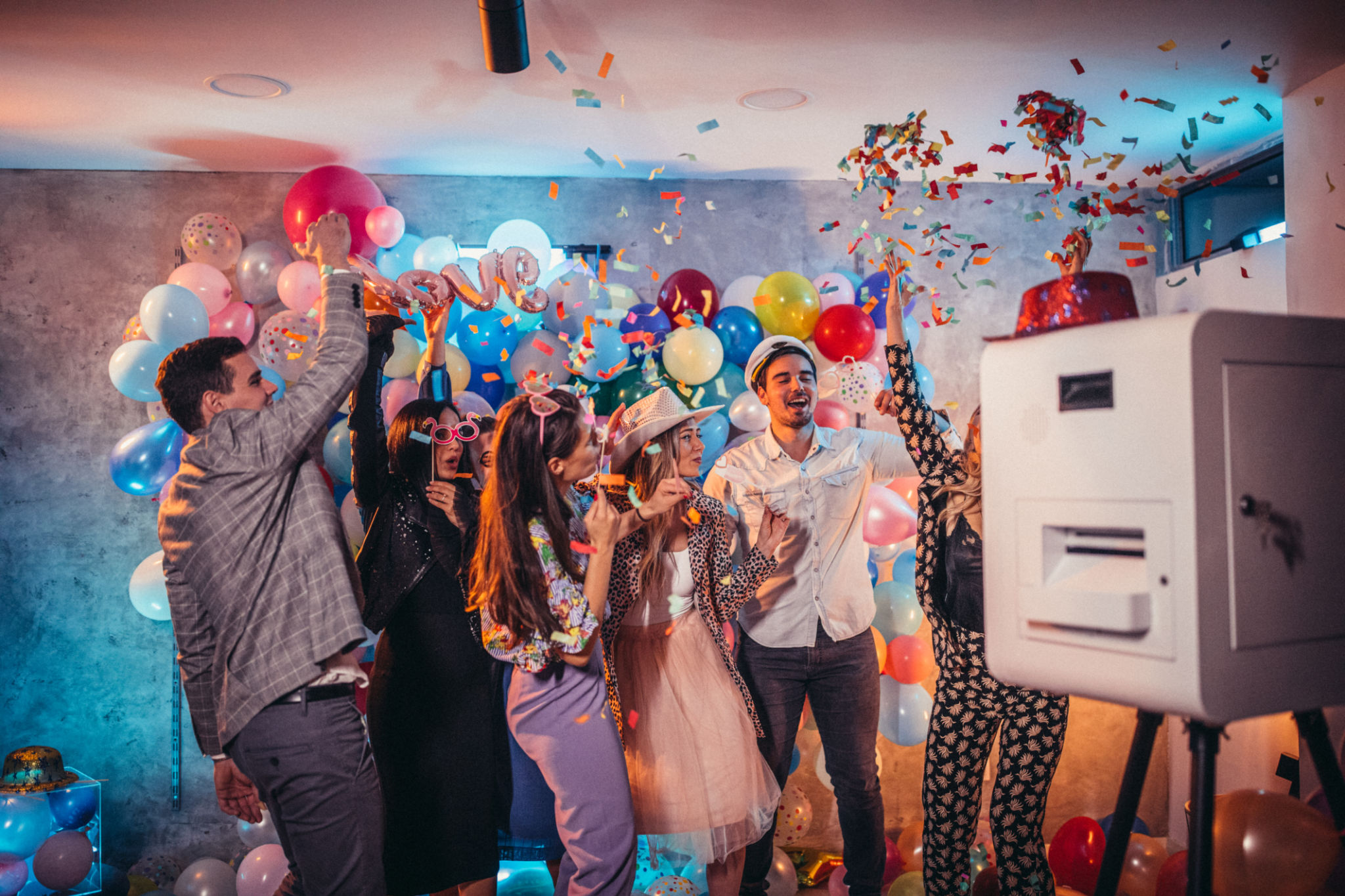 Group of people, men and women having fun together at new year's eve party.